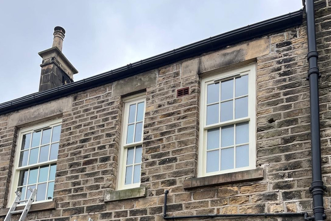 Three all-new sash windows of different sizes side-by-side (photograph)